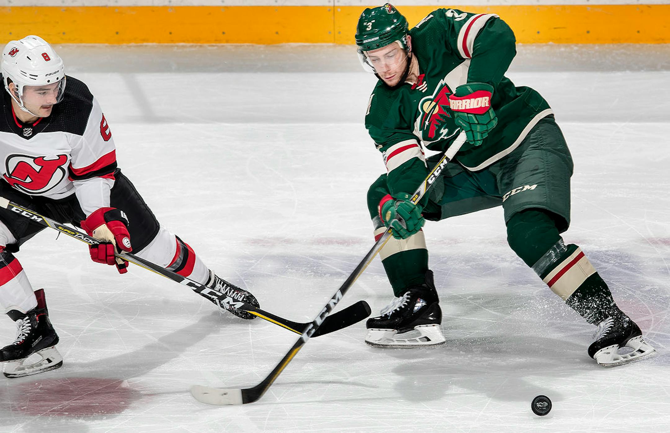 Will Butcher (8) and Charlie Coyle (3) fought for the puck in the second period.
