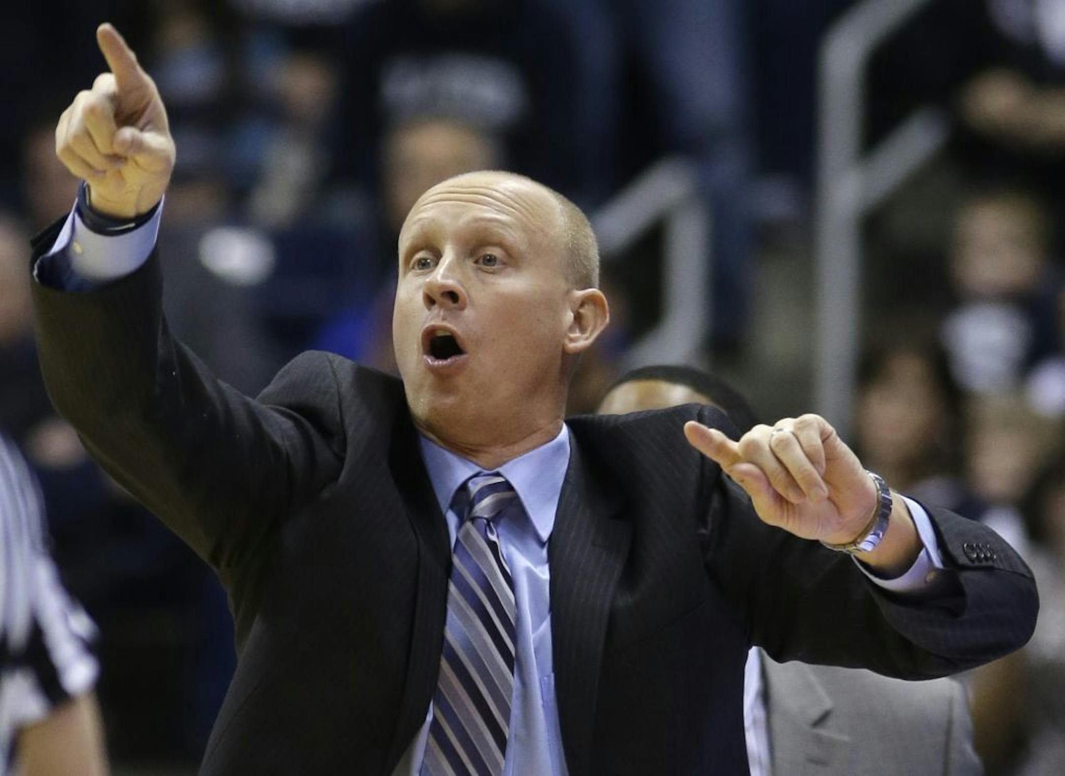 Xavier head coach Chris Mack yells instructions in the first half of an NCAA college basketball game against Virginia Commonwealth in February..