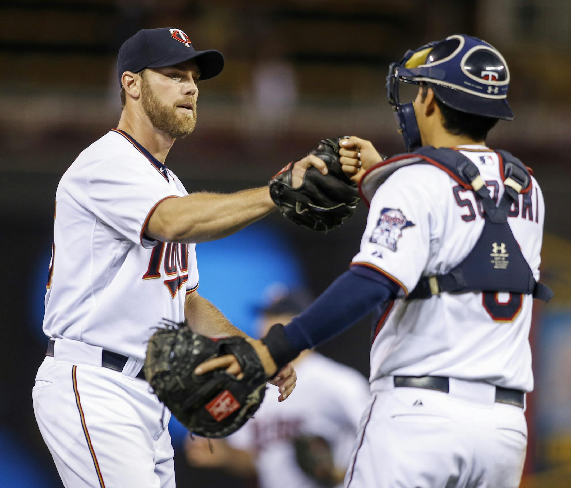 Reliever Neal Cotts, who was acquired by the Twins in midseason last year, celebrated a victory with catcher Kurt Suzuki.