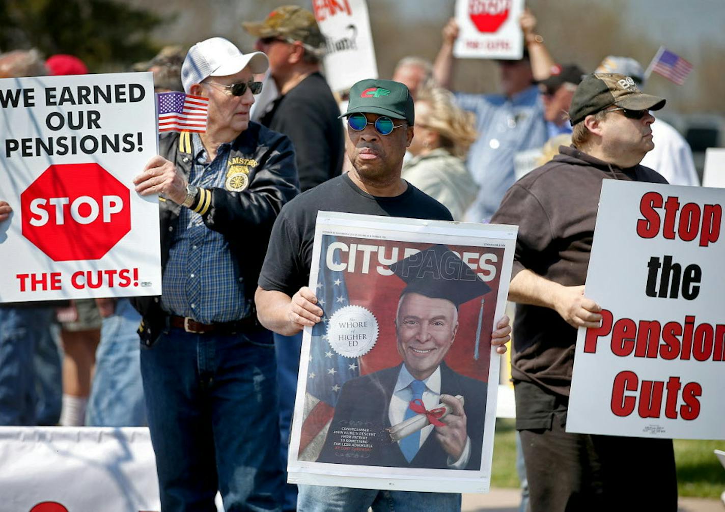 Ron Kretlow, cq, left, who worked more than 25 years for a trucking company, Michael Trotter, cq, center, who worked for 27 years at a freight company, and Larry Smith, right, who worked 38 years for a cement company, joined other Teamsters for a rally outside the offices of U.S. Rep. John Kline, Thursday, April 14, 2016 in Burnsville, MN. ] (ELIZABETH FLORES/STAR TRIBUNE) ELIZABETH FLORES &#x2022; eflores@startribune.com