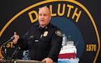 Duluth Police Chief Mike Tusken speaks from the podium during a press conference to speak about the scene the day prior where five people and a dog we