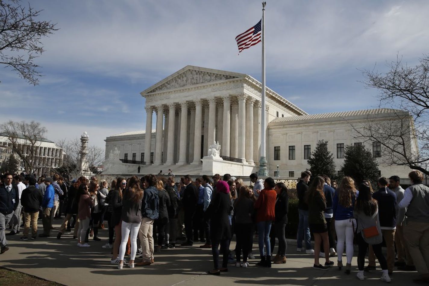 People wait in line to enter the Supreme Court, Wednesday, Feb. 28, 2018, in Washington.