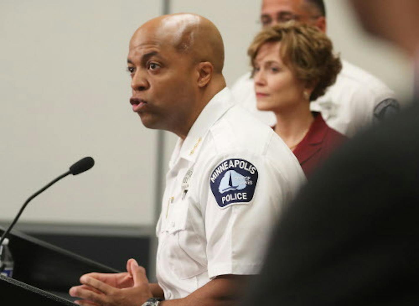 As Minneapolis mayor Betsy Hodges looks on, acting Police Chief Medaria Arradondo announces that Minneapolis police will be required to activate their body cameras on all calls and the department will start implementing the new rule starting Saturday, on Wednesday, July 26, 2017, at the Minneapolis Emergency Operations Training Facility in Minneapolis. (David Joles/Minneapolis Star Tribune/TNS) ORG XMIT: 1207357