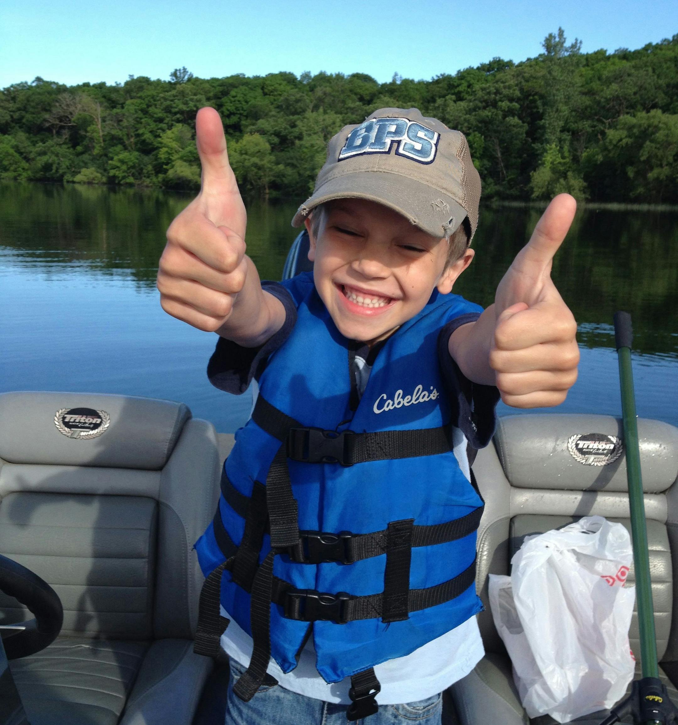 Hunter Heyrman, 6, is excited after boating a nearly 40-inch northern pike while fishing with his dad, Chad.