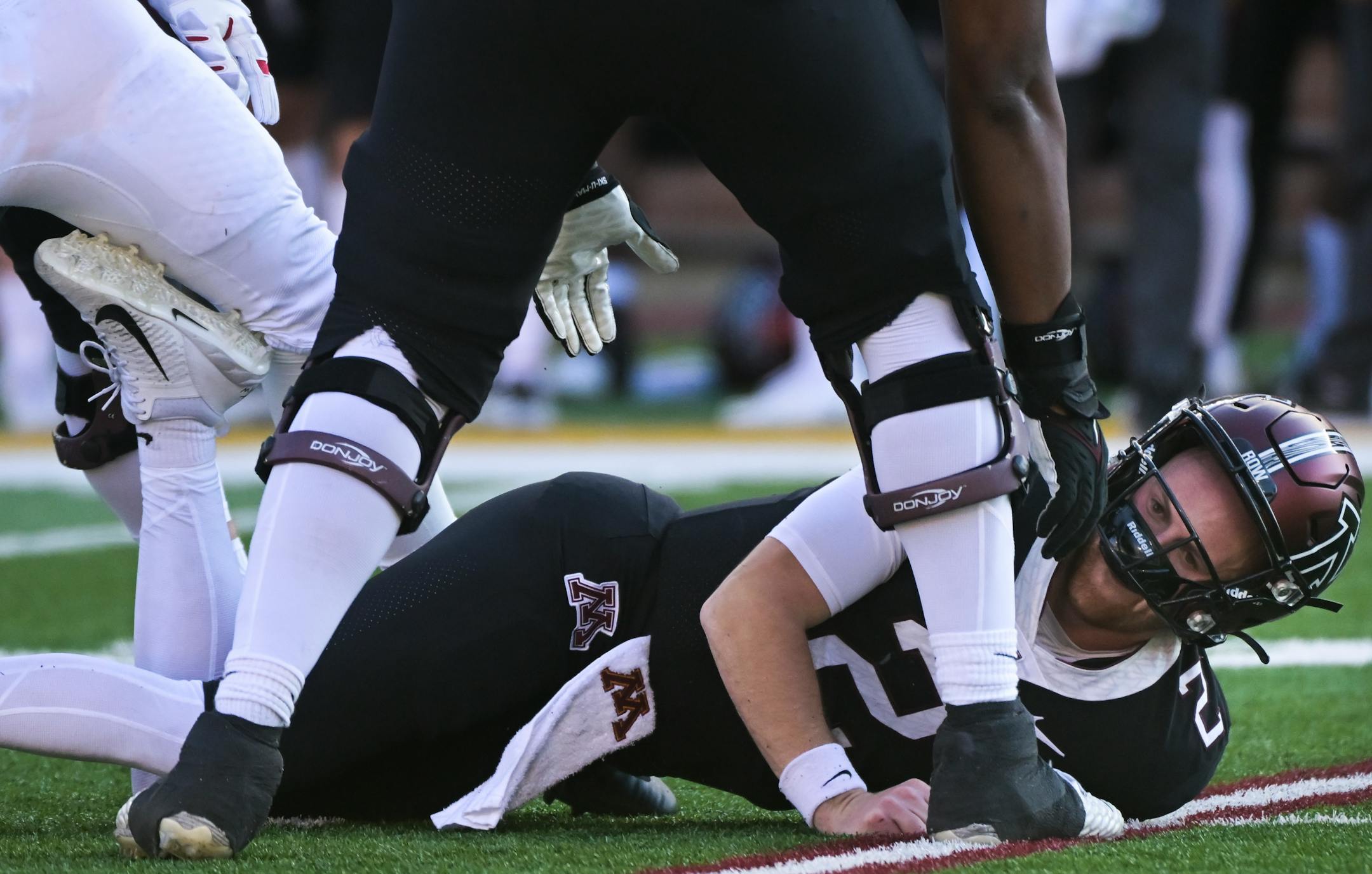 Minnesota Golden Gophers quarterback Tanner Morgan (2) looks dazed after being tackled during the third quarter.