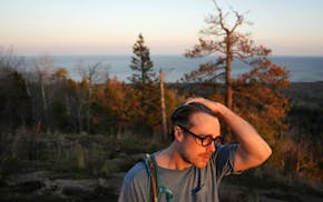 Musician Jeremy Messersmith takes in the view from atop the Superior Hiking Trail’s Oberg Mountain Loop during an evening hike Tuesday, May 6, 2025,