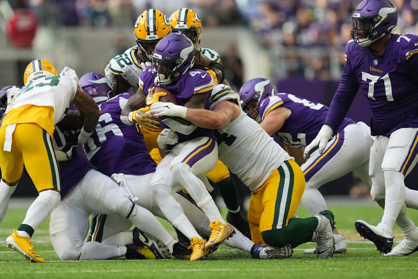 Minnesota Vikings running back Dalvin Cook (4) is smothered by the Green Bay Packers defense as he rushes the ball in the second quarter of the Minnesota Vikings season opener against the Green Bay Packers Sunday, Sept. 11, 2022 at U.S. Bank Stadium in Minneapolis. ] ANTHONY SOUFFLE • anthony.souffle@startribune.com