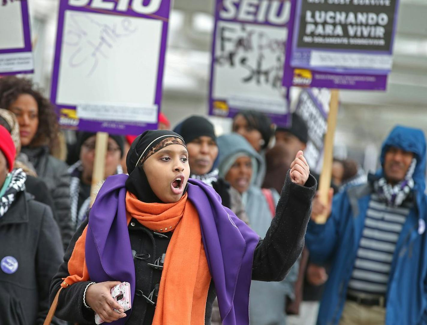 Randa Jama, cq, led a group of janitors and their supporters as they went on strike for a day at Lindbergh Terminal, Wednesday, February 17, 2016 in Bloomington, MN.