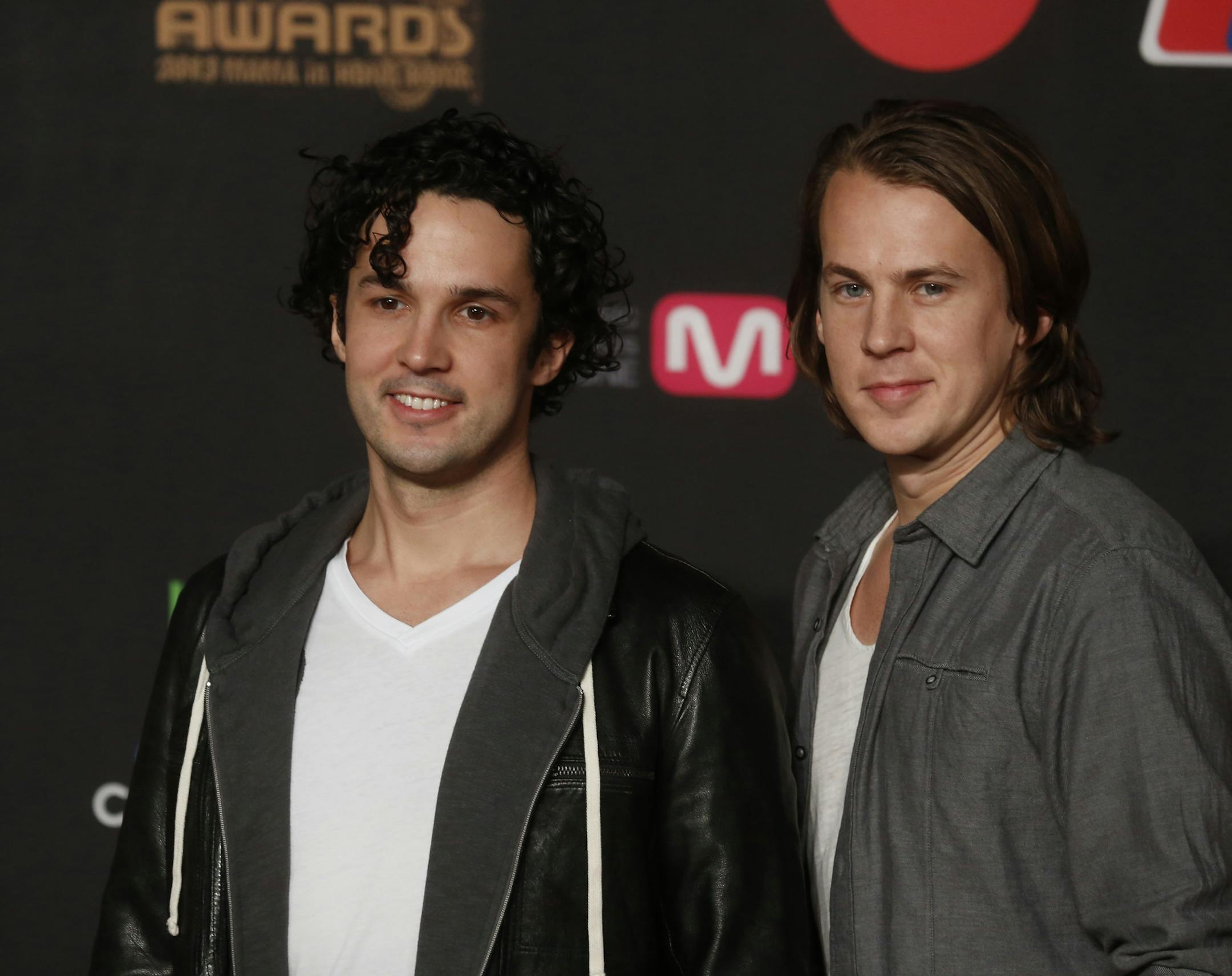 Members of Norwegian duo Ylvis pose for photographers on the red carpet of the South Korean Mnet Asian Music Awards (MAMA) in Hong Kong Friday, Nov. 22, 2013. (AP Photo/Kin Cheung)