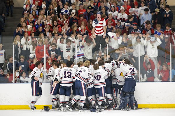 Orono celebrates winning the Class 1A, Section 2 title with their student section. Photo by Cheryl A. Myers, SportsEngine