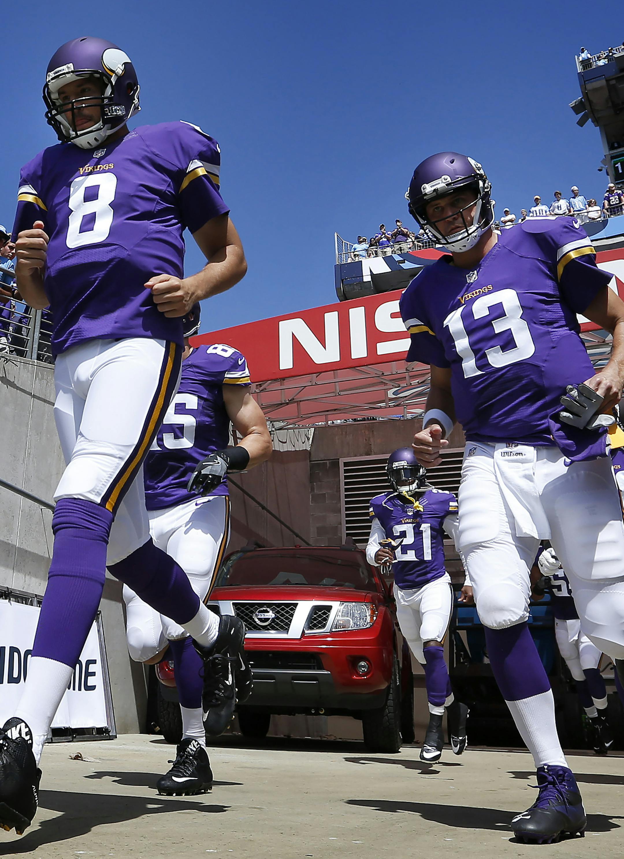 Minnesota Vikings quarterbacks Sam Bradford (8) and Shaun Hill (13) ran out during team introductions. ] CARLOS GONZALEZ cgonzalez@startribune.com - September 11, 2016, Nashville, TN, Nissan Stadium, NFL, Minnesota Vikings vs. Tennessee Titans