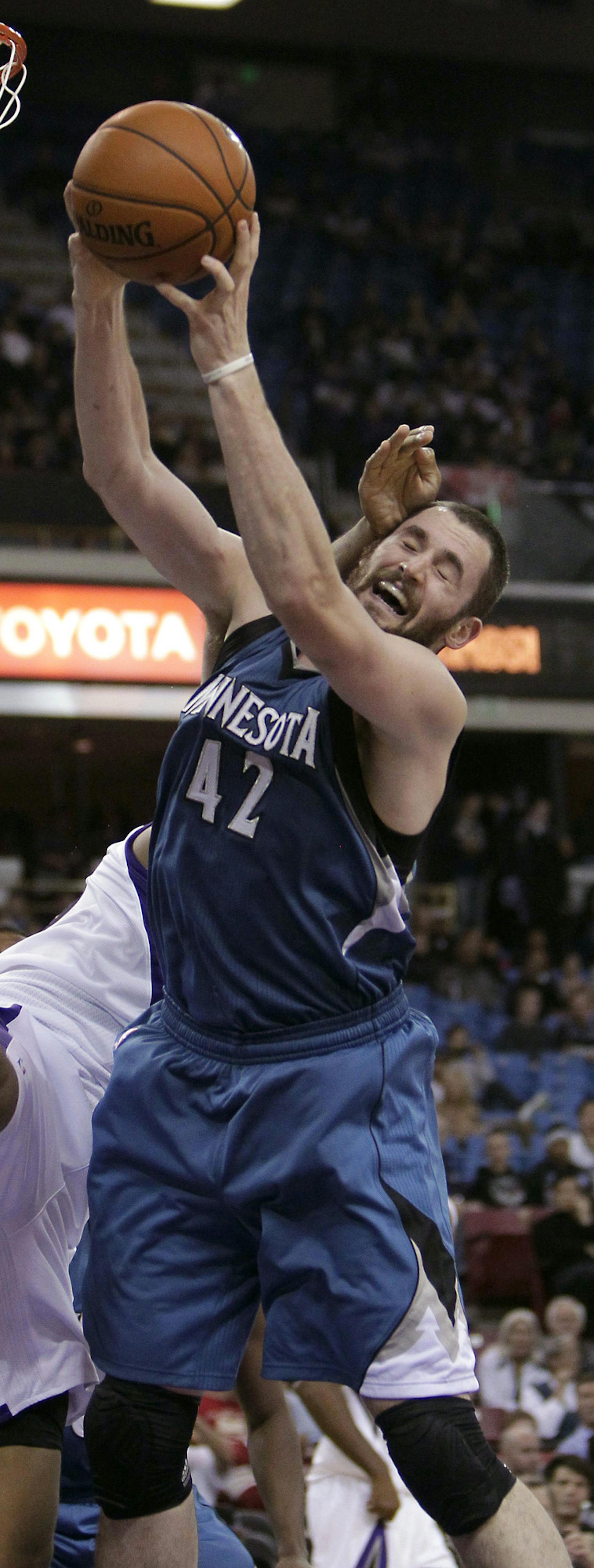 Minnesota Timberwolves forward Kevin Love, right, is fouled by Sacramento Kings center DeMarcus Cousins, left, as he grabs a rebound during the third quarter of an NBA basketball game in Sacramento, Calif., Tuesday, Nov. 27, 2012. The Timberwolves won 97-89. (AP Photo/Rich Pedroncelli) ORG XMIT: SCA110