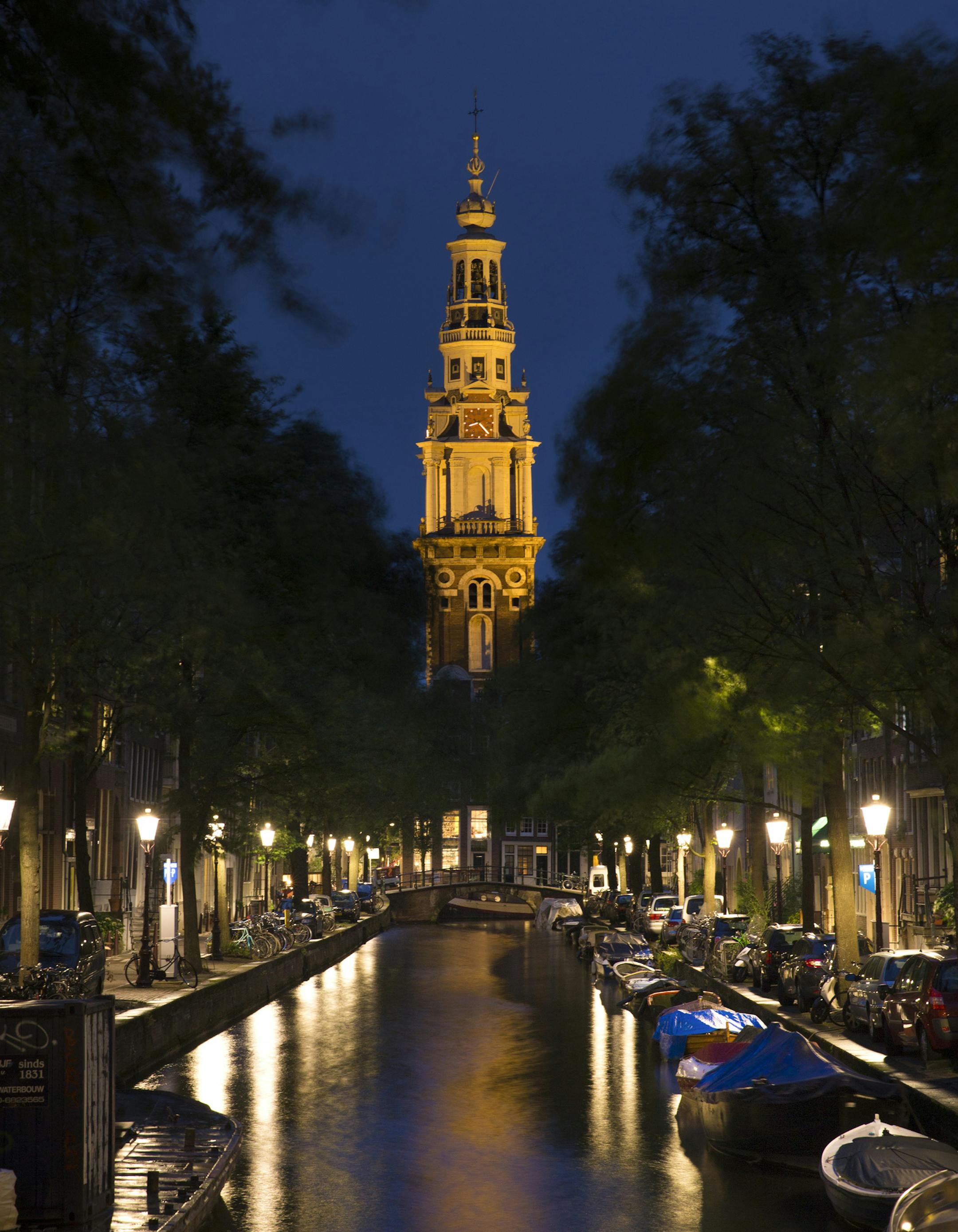 A view of the Groenburgwal canal and the Zuiderkerk church tower in Amsterdam, Sept. 15, 2013. People visiting Amsterdam will find that some of the memories or ghosts of historic names, like Karl Marx, Vincent van Gogh, Rembrandt van Rijn and Anne Frank, some of whom have never lived in the city, are perennially passing through, eternally re-enacting a moment they spent there in life. (Ilvy Njiokiktjien/The New York Times) -- PHOTO MOVED IN ADVANCE AND NOT FOR USE - ONLINE OR IN PRINT - BEFORE S