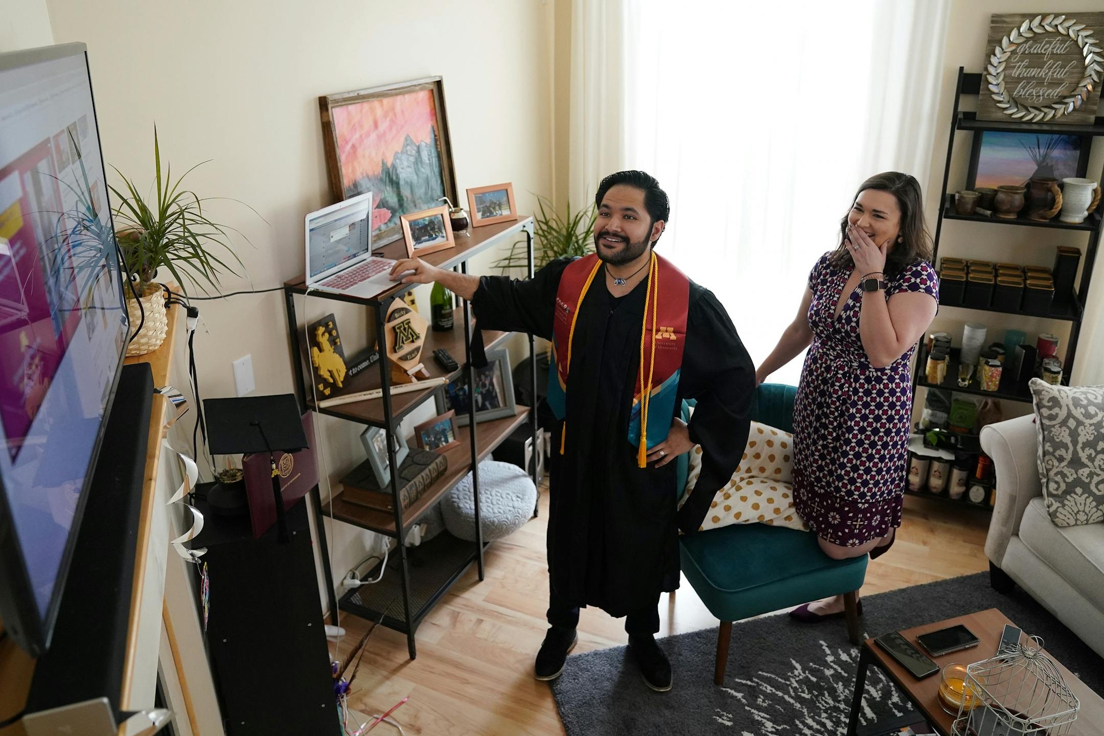 Izaak Mendoza navigated to the video commencement address in his graduation robes alongside his wife Becky and his family who were on a video call from their home in Wyoming Saturday.