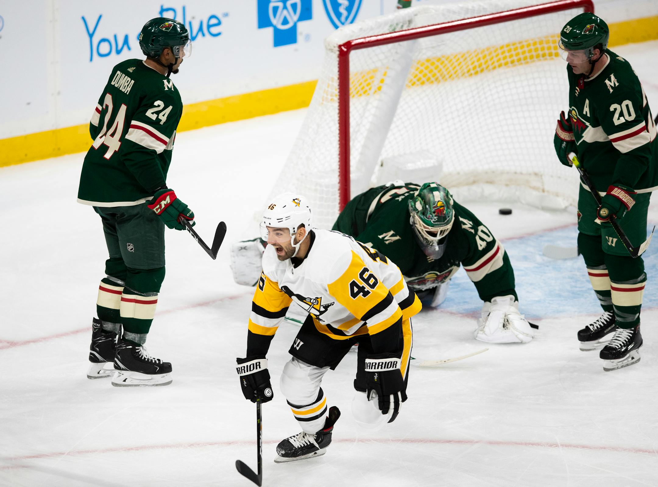 Penguins center Zach Aston-Reese (46) celebrated a second-period goal by teammate Adam Johnson (not pictured) in a 7-4 victory over the Wild at Xcel Energy Center on Saturday.