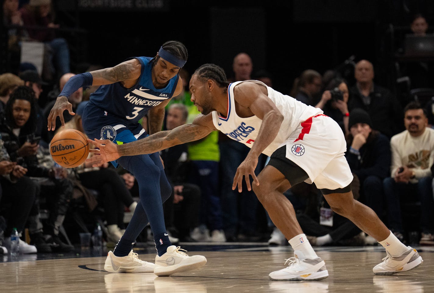 LA Clippers forward Kawhi Leonard (2) tried to strip Minnesota Timberwolves forward Jaden McDaniels (3) of the ball in the second quarter. The Minnesota Timberwolves faced the LA Clippers in an NBA basketball game Sunday night, January 14, 2024 at Target Center in Minneapolis. ] JEFF WHEELER • Jeff.Wheeler@startribune.com