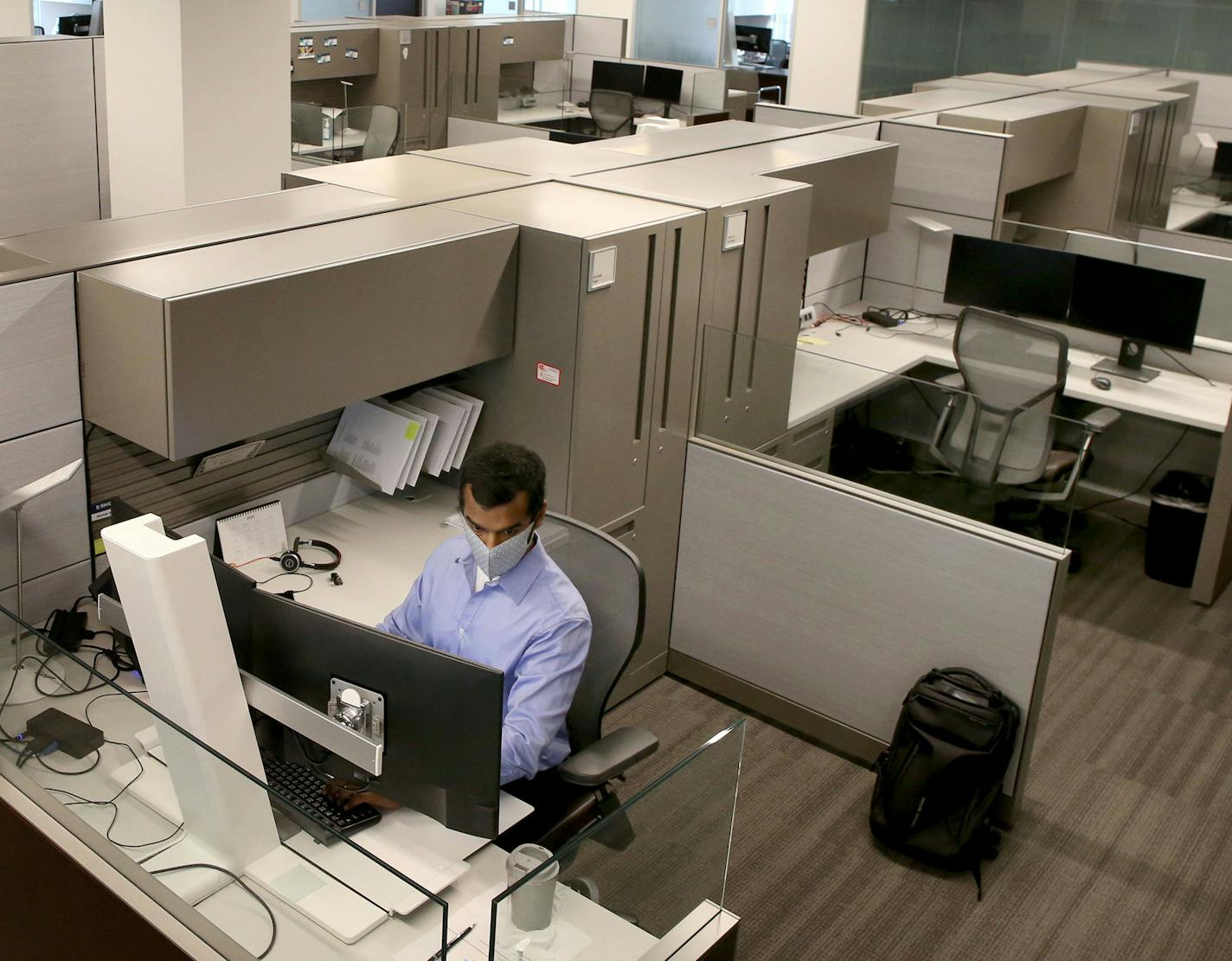 Sikich senior account Priyank Shah works alone in a 25,000 square foot space at the Sikich's office in downtown Chicago, as most of his co-workers work from home due to the coronavirus pandemic, Tuesday, Aug. 18, 2020. (Antonio Perez/ Chicago Tribune/TNS)