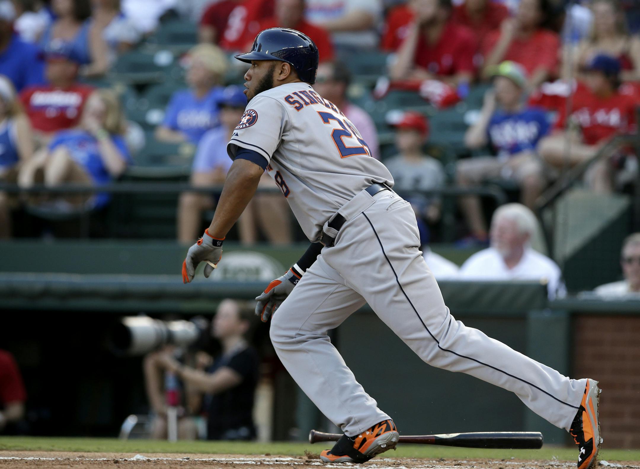 Houston Astros' Jon Singleton sprints out of the batters box on a run scoring single off a pitch from Texas Rangers' Phil Irwin in the first inning of a baseball game, Tuesday, July 8, 2014, in Arlington, Texas. The hit scored George Springer. (AP Photo/Tony Gutierrez) ORG XMIT: NYOTK