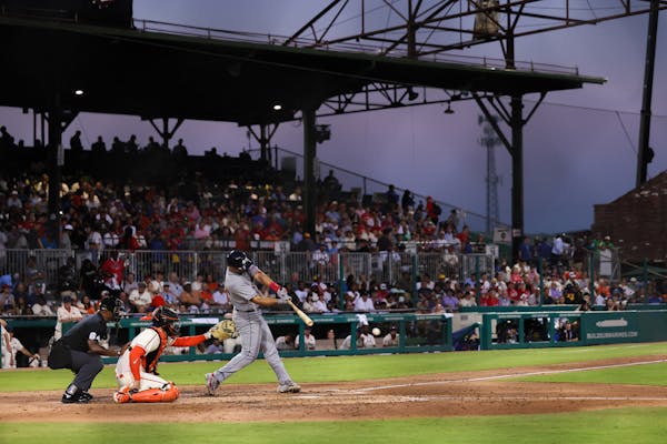 The Cardinals' Paul Goldschmidt hits a single during the fifth inning against the Giants on Thursday night at Rickwood Field in Birmingham, Ala.
