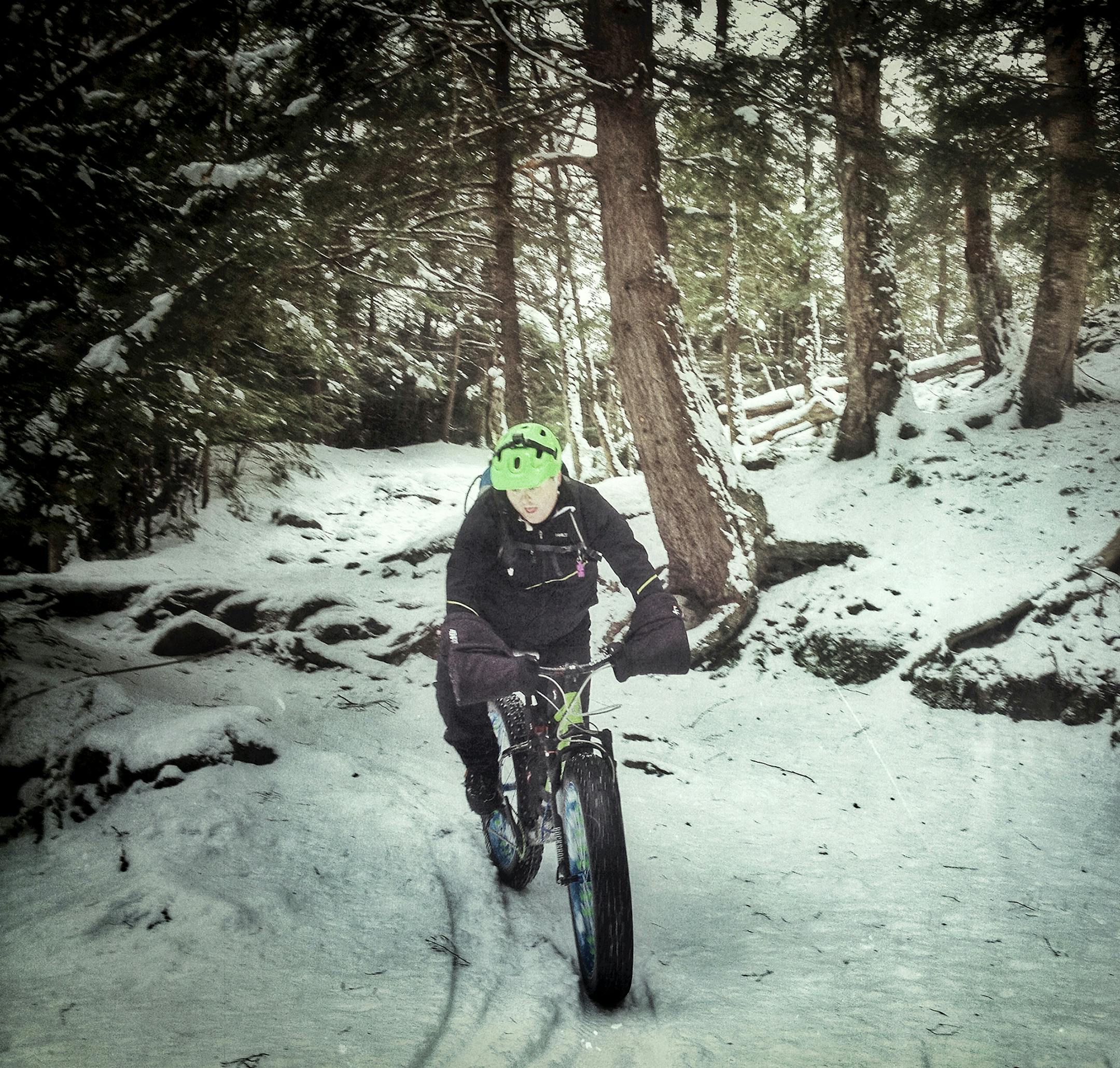 A fat-tire biker rolls over November snow at Gatineau Hills, in Quebec, Canada. Illustrates SNOW-BIKES (category t), by Melanie D.G. Kaplan, special to The Washington Post. Moved Tuesday, Dec. 9, 2014. (MUST CREDIT: Photo by Christian Lalonde.)