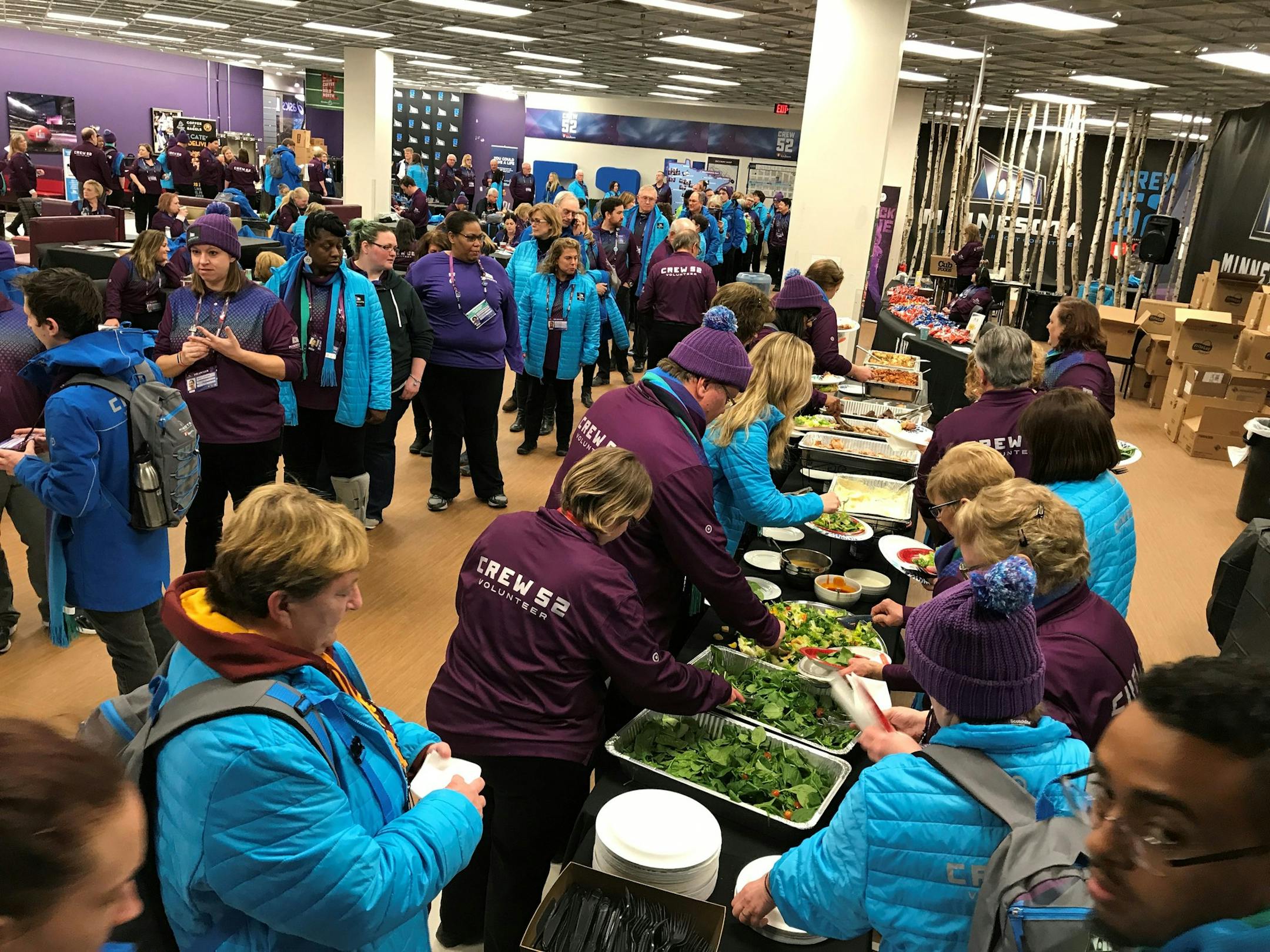 Crew 52 volunteers grab dinner during a break on Sunday. (photo by Eric Roper)