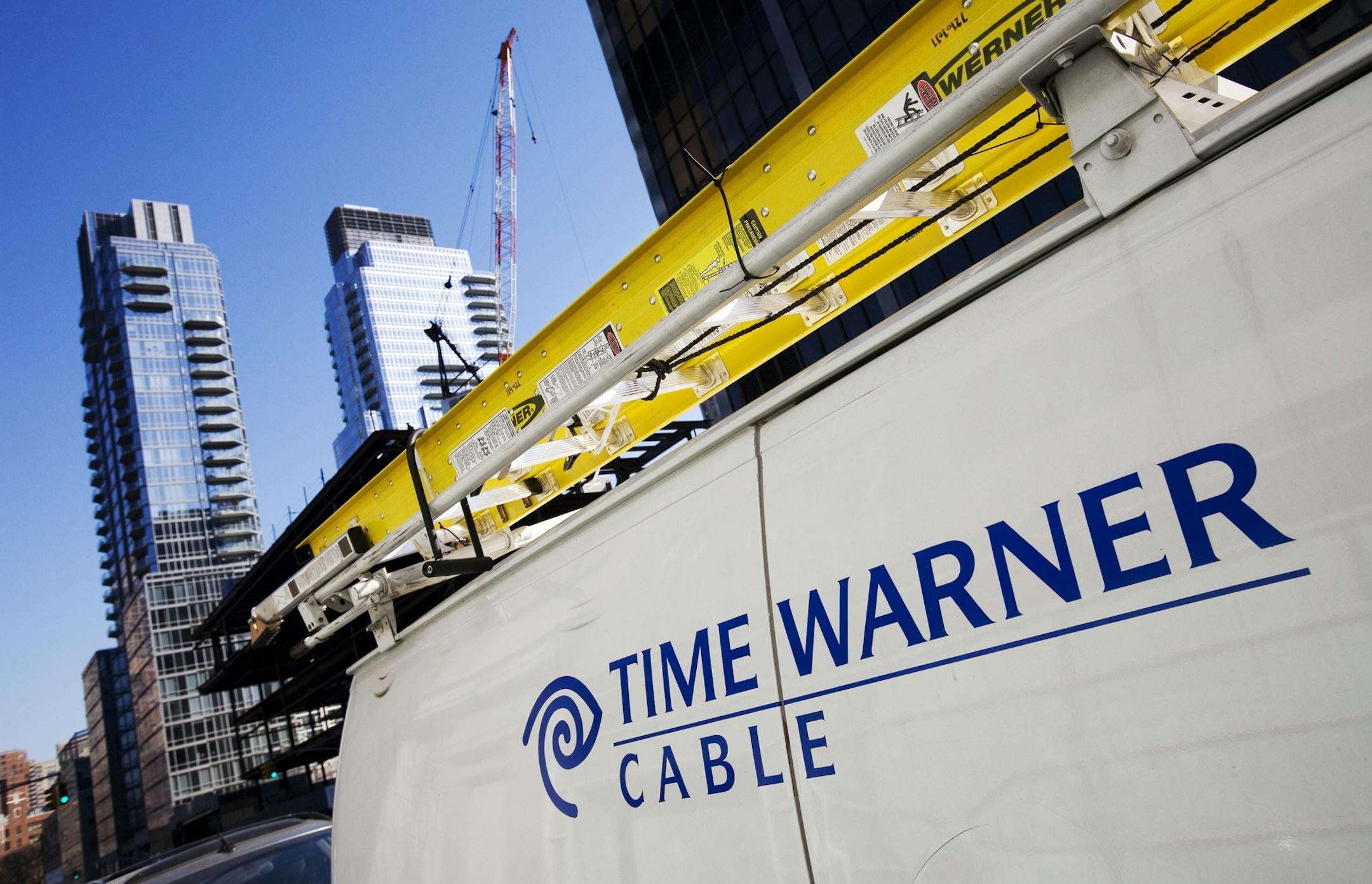 FILE - In this Feb. 2, 2009 file photo, a Time Warner Cable truck is parked in New York. Time Warner Cable Inc. reports quarterly earnings on Wednesday, April 30, 2014. (AP Photo/Mark Lennihan, File)