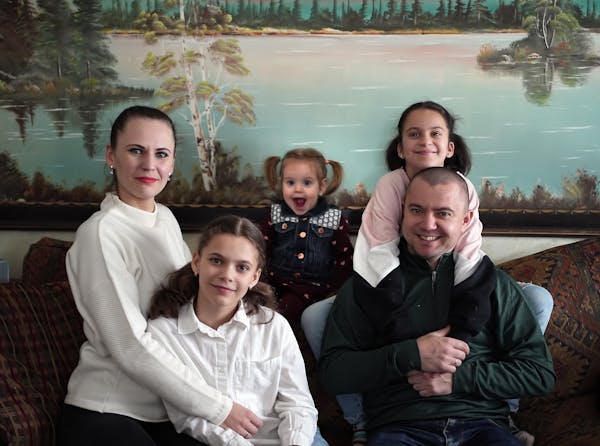 Vadym Holiuk, shown with his wife, Liubov, and daughters Nastya, Anita and Alisa, was an electrical engineer working on the railroad in Ukraine. When 