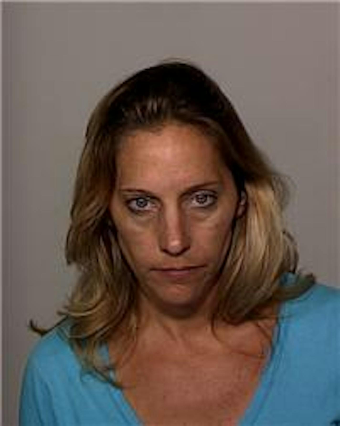 Paula Lynn Larson has been charged with driving drunk and fatally colliding in her SUV with two people on a motorcycle in East Bethel.