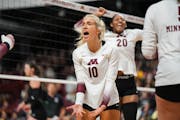 Elise McGhie (10) screamed while Arica Davis (20) pumped her fist during the Gophers’ come-from-behind victory over Northwestern on Sunday.