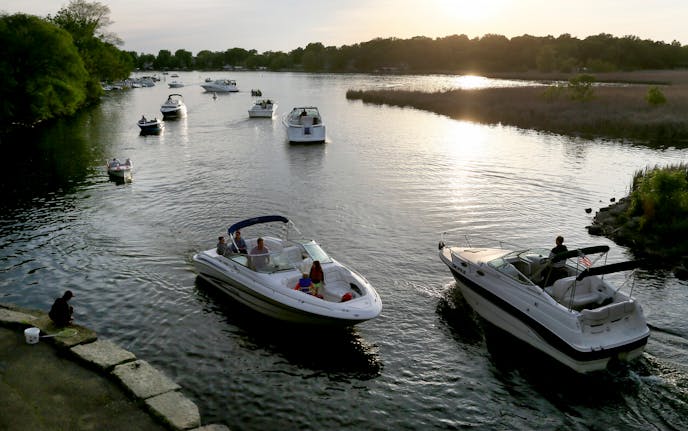 Boat traffic was heavy on Lake Minnetonka as daylight faded Friday, May 22, 2015, near Lord Fletcher's in Spring Park, MN.](DAVID JOLES/STARTRIBUNE)djoles@startribune.com As boaters flock to Minnesota lakes and rivers this holiday weekend for the unofficial kick-off to the boating season, they'll face more inspections in and out of the water as local cities and counties ramp up their work to stop the spread of invasive species. Across the metro, more boat accesses will be staffed by watercraft inspectors thanks to $10 million funneled to county government programs this year, up from $4.5 million the state allocated last year. ORG XMIT: MIN1505222156290209 ORG XMIT: MIN1506021218440580