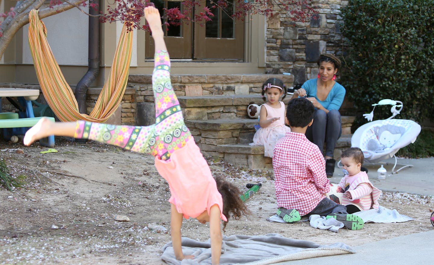 Debra Shigley plays with her children in their backyard in Atlanta, Georgia on Friday, March 22, 2019. (Emily Haney/Atlanta Journal-Constitution/TNS)