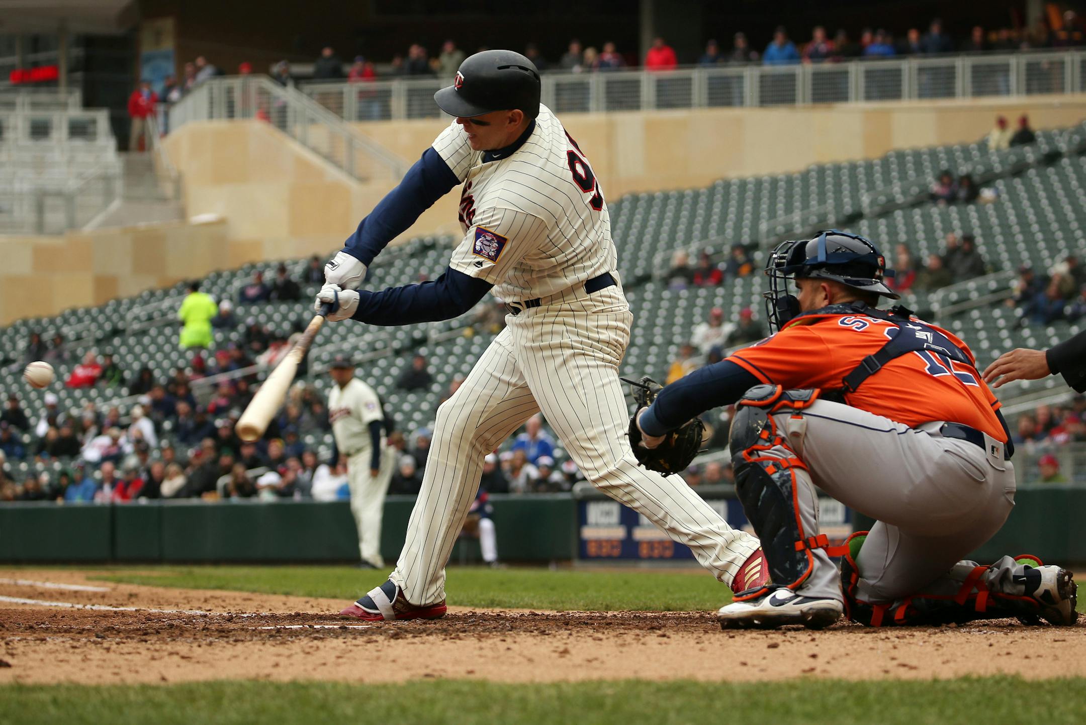 Minnesota Twins first baseman Logan Morrison (99) hit a single allowing Minnesota Twins left fielder Eddie Rosario (20) to score in the fourth inning. ] ANTHONY SOUFFLE ï anthony.souffle@startribune.com The Minnesota Twins played the Houston Astros in an MLB game Wednesday, April 11, 2018 at Target Field in Minneapolis.