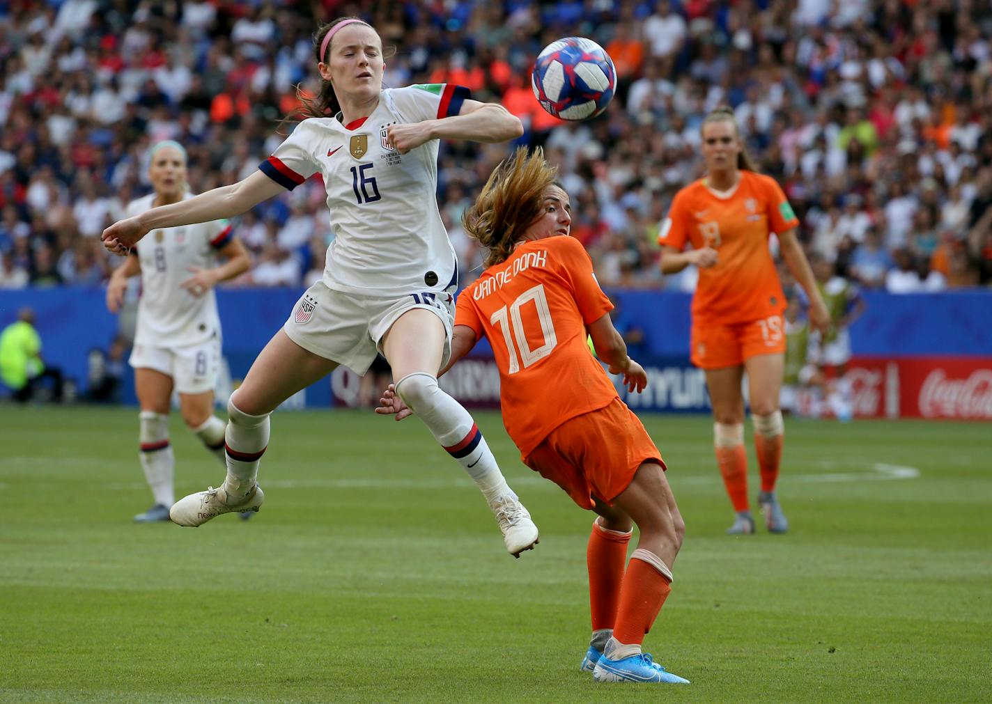 United States' Rose Lavelle, left, is challenged by Netherlands' Danielle Van De Donk during the Women's World Cup final soccer match between US and The Netherlands on July 7, 2019.