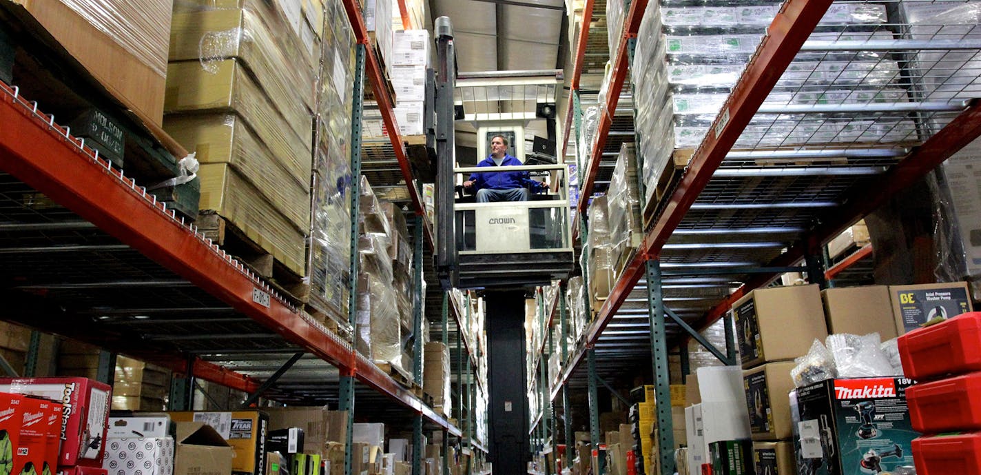 In this March 5, 2015 photo, Mike Drury retrieves a pallet at the Hardware Sales Inc. warehouse in Ferndale, Wash. Hardware Sales Inc. officials say the company's e-commerce division could benefit from streamlined customs regulations if 12 Pacific Rim countries agree to a massive trade deal called the Trans-Pacific Partnership. Critics say the deal doesn&#xed;t do enough to protect American jobs. (AP Photo/Manuel Valdes) ORG XMIT: MIN2015042414225347