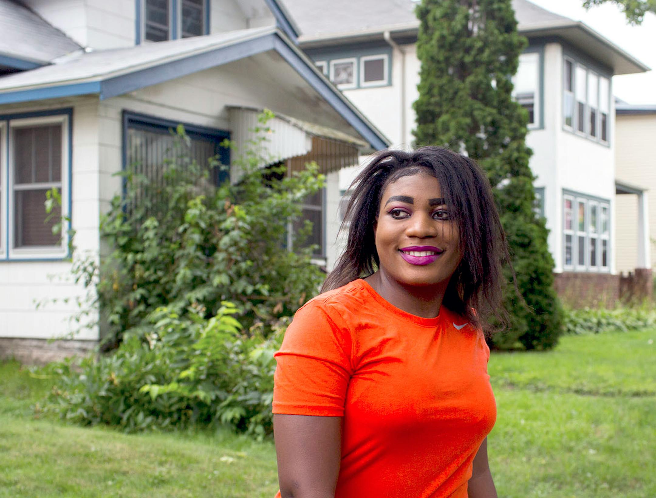 Lydia Mihigo looks back at her family during a walk around the block in St. Paul, on Sunday afternoon.