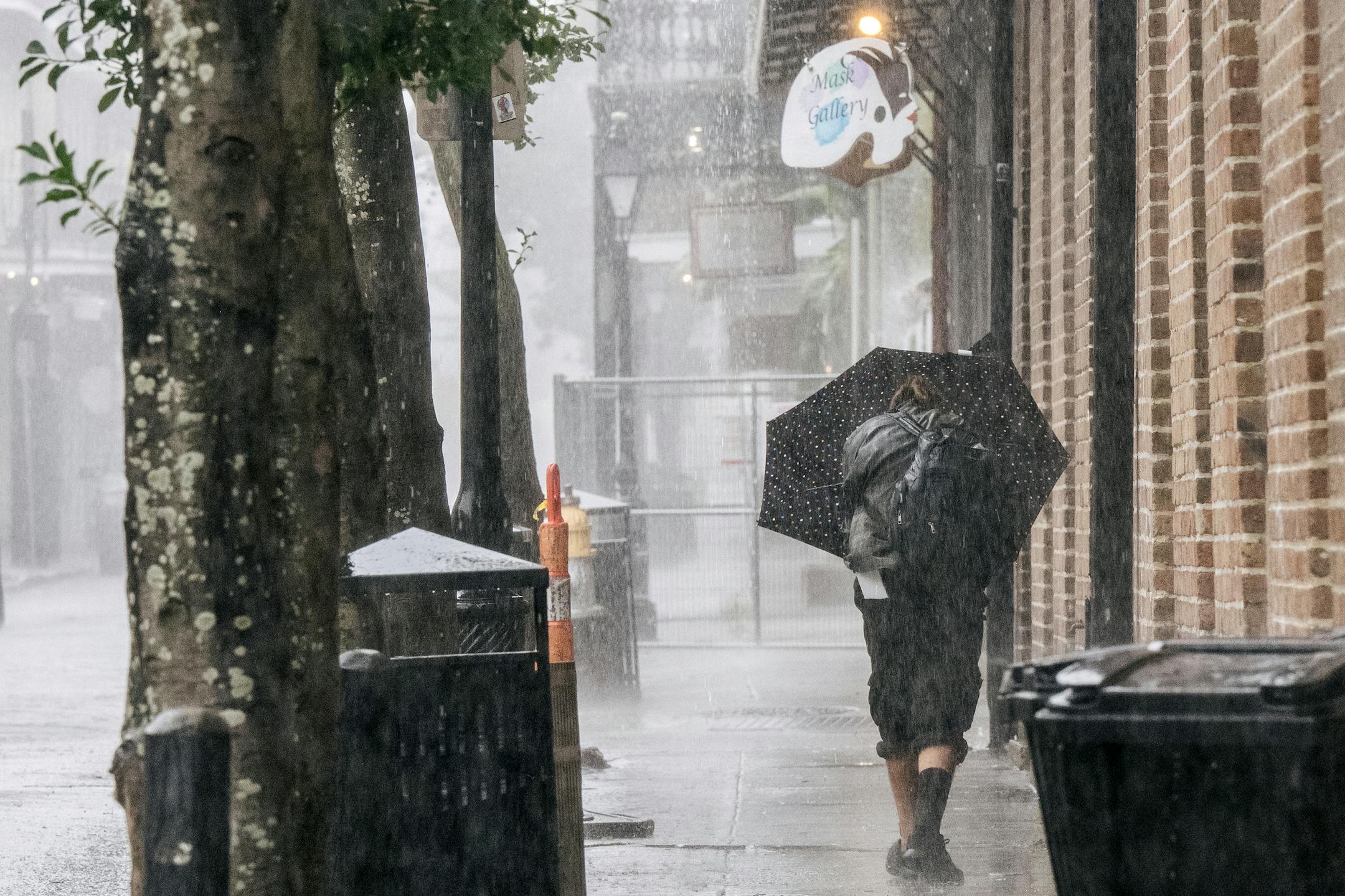 A person walks through the French Quarter ahead of Hurricane Ida on August 29, 2021 in New Orleans, Louisiana. Residents of New Orleans continue to prepare as the outer bands of the hurricane begin to cut across the city. Ida is expected to make landfall as a Category 4 storm later today. (Brandon Bell/Getty Images/TNS) ORG XMIT: 25603654W