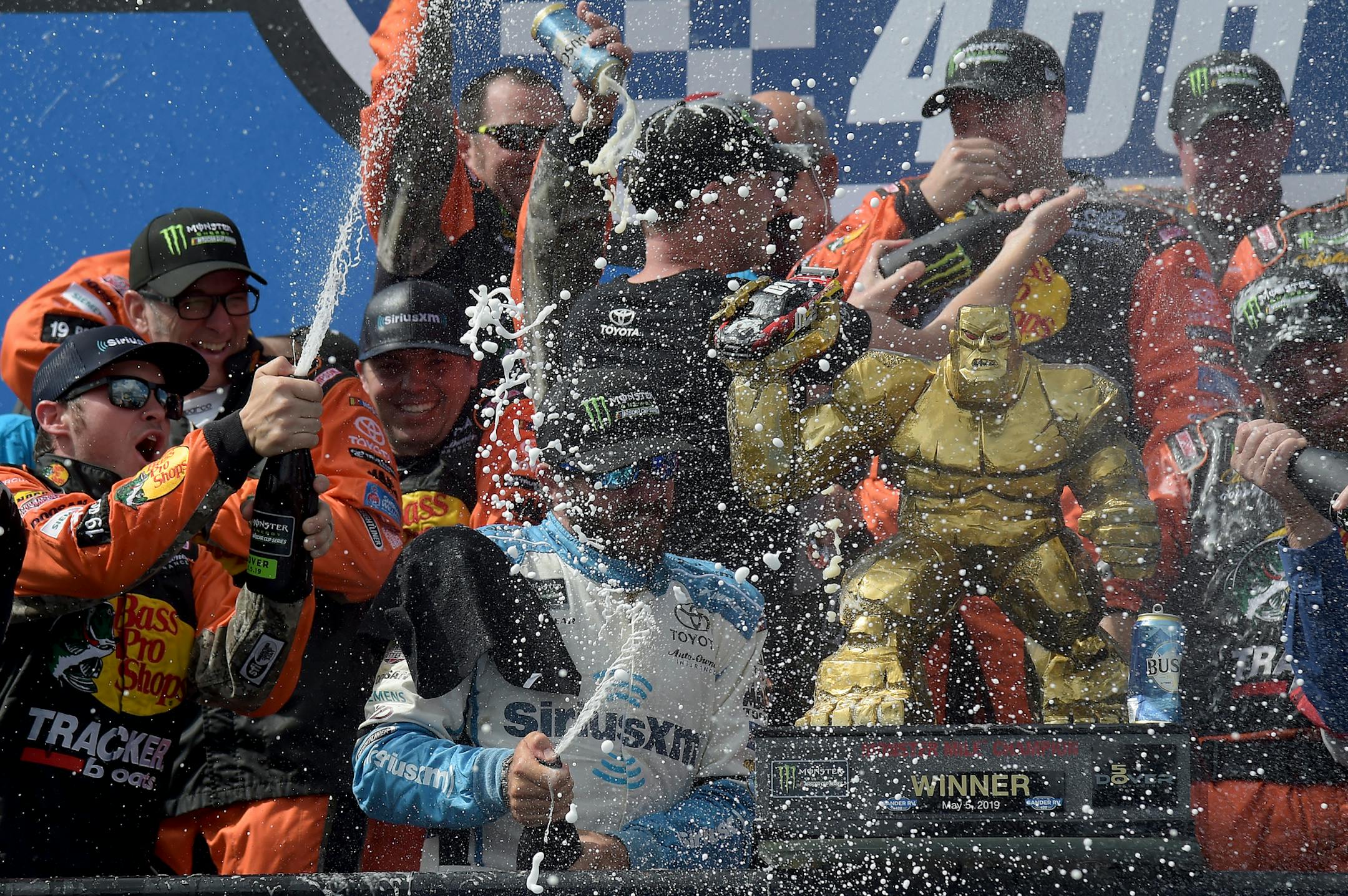 Driver Martin Truex Jr. (19) celebrated with his crew after winning the NASCAR Cup Series race Monday at Dover International Speedway in Dover, Del.