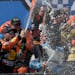 Driver Martin Truex Jr. (19) celebrated with his crew after winning the NASCAR Cup Series race Monday at Dover International Speedway in Dover, Del.