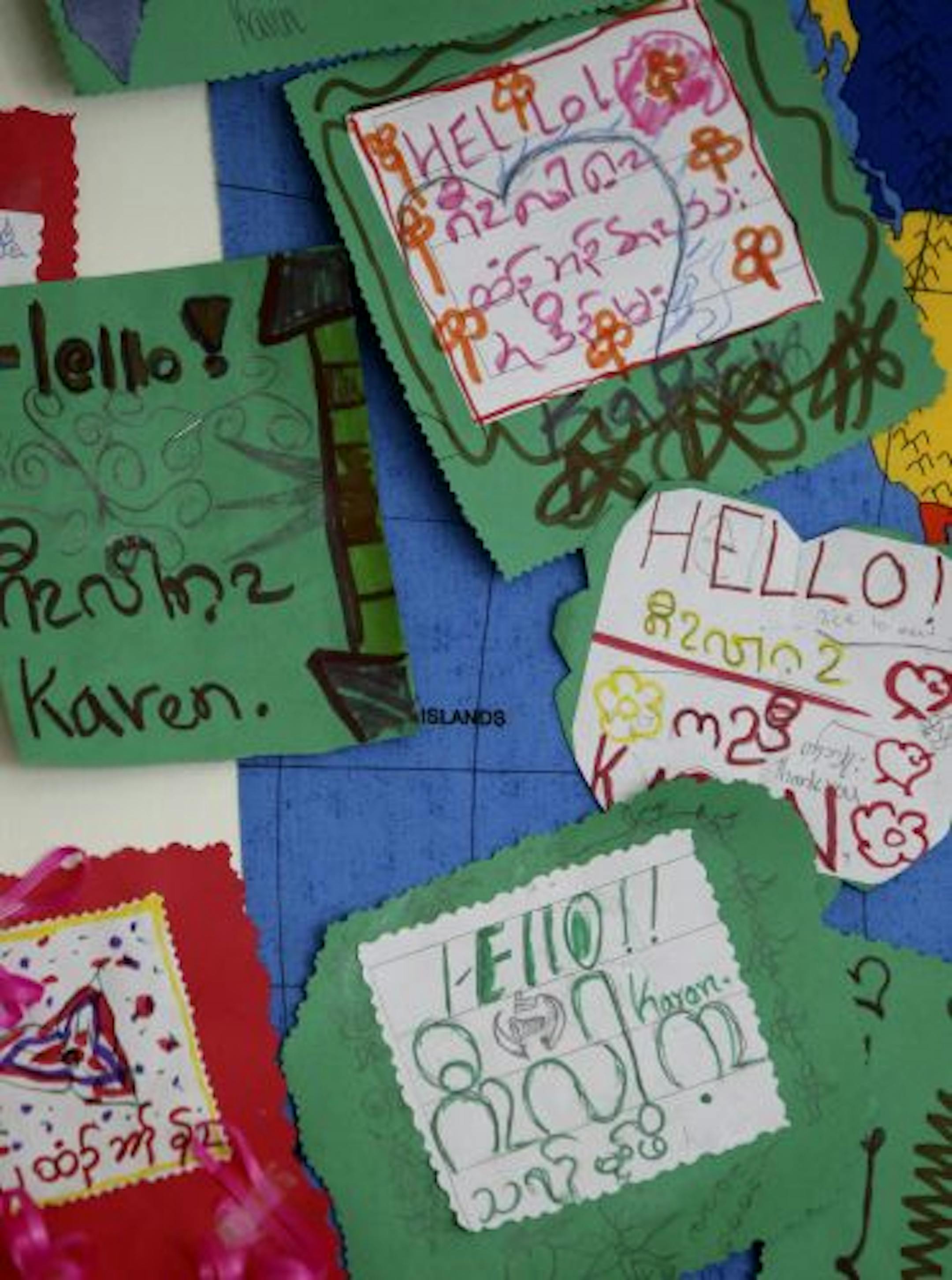 Joyce Pham had students write "hello" in the language of their homelands.