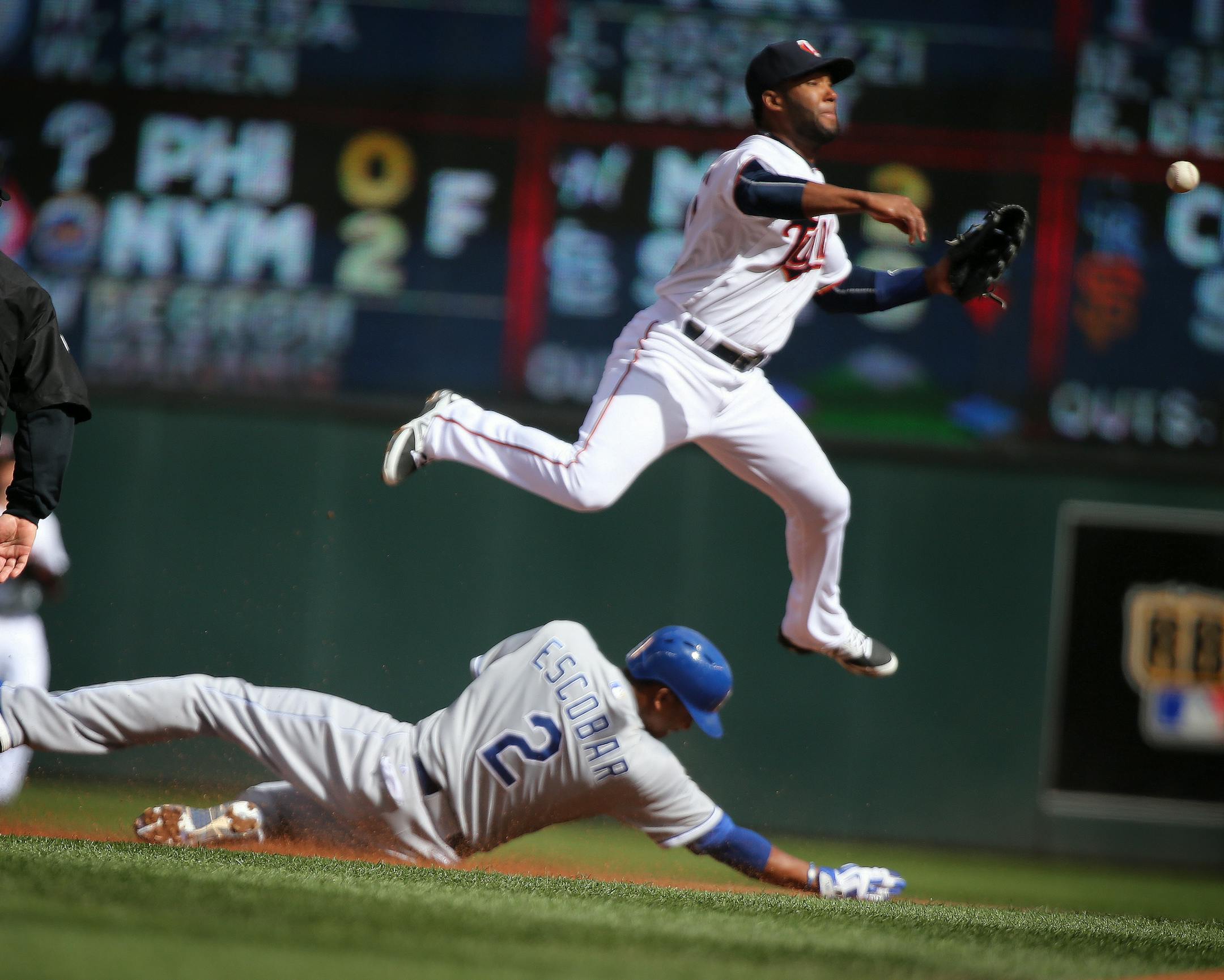 Danny Santana fails to make a double play from second base as Alcides Escobar of the Royals slides in safe during the Twins home opener against the Kansas City Royals at Target Field in Minneapolis on Monday, April 13, 2015. ] LEILA NAVIDI leila.navidi@startribune.com /
