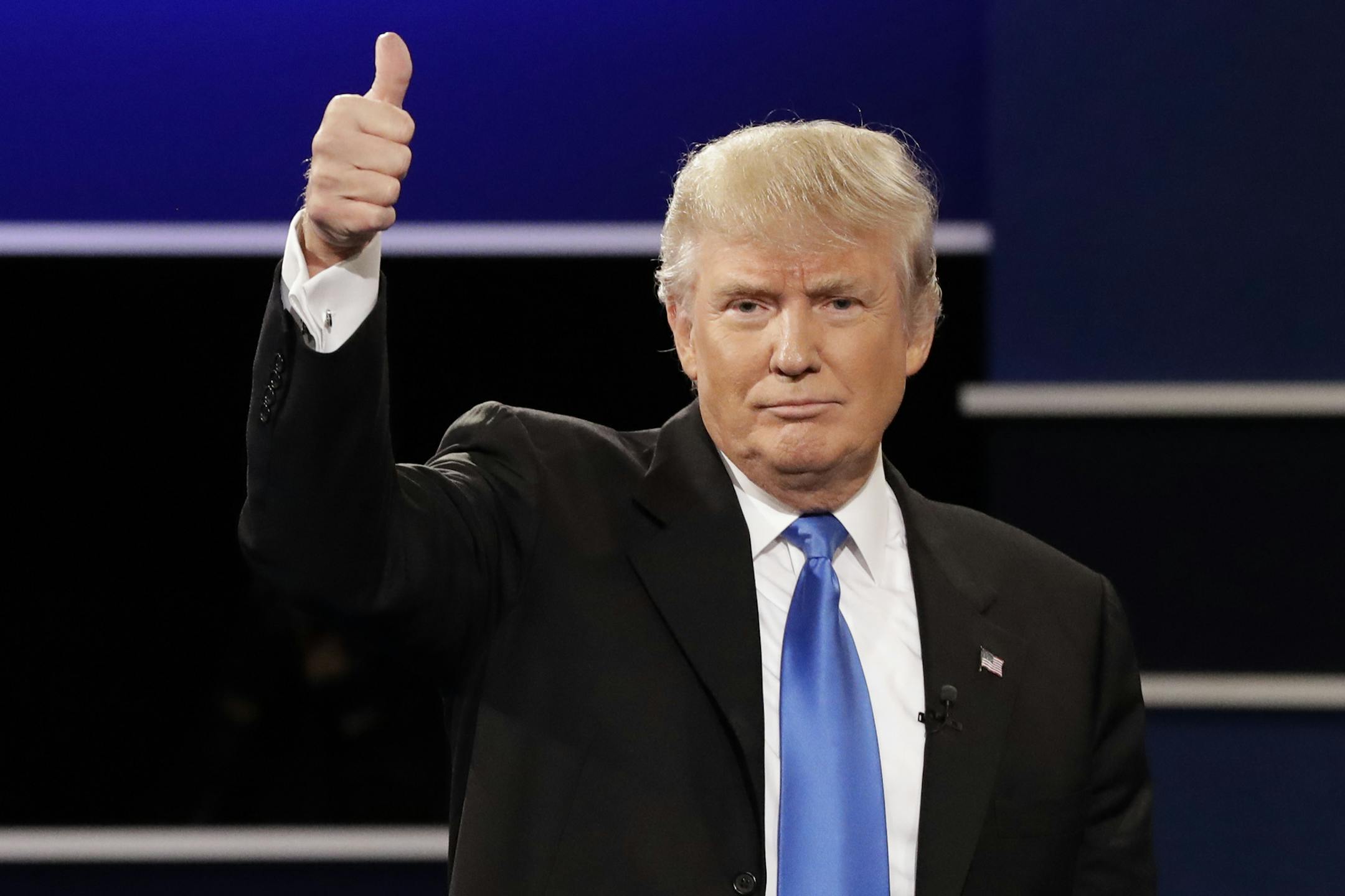 Republican presidential nominee Donald Trump flashes a thumbs up after the presidential debate with Democratic presidential nominee Hillary Clinton at Hofstra University in Hempstead, N.Y., Monday, Sept. 26, 2016. (AP Photo/David Goldman)