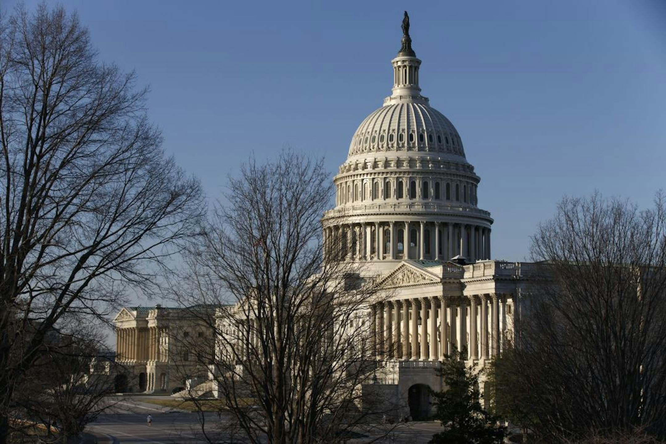 The morning sun illuminates the Capitol in Washington as Congress.