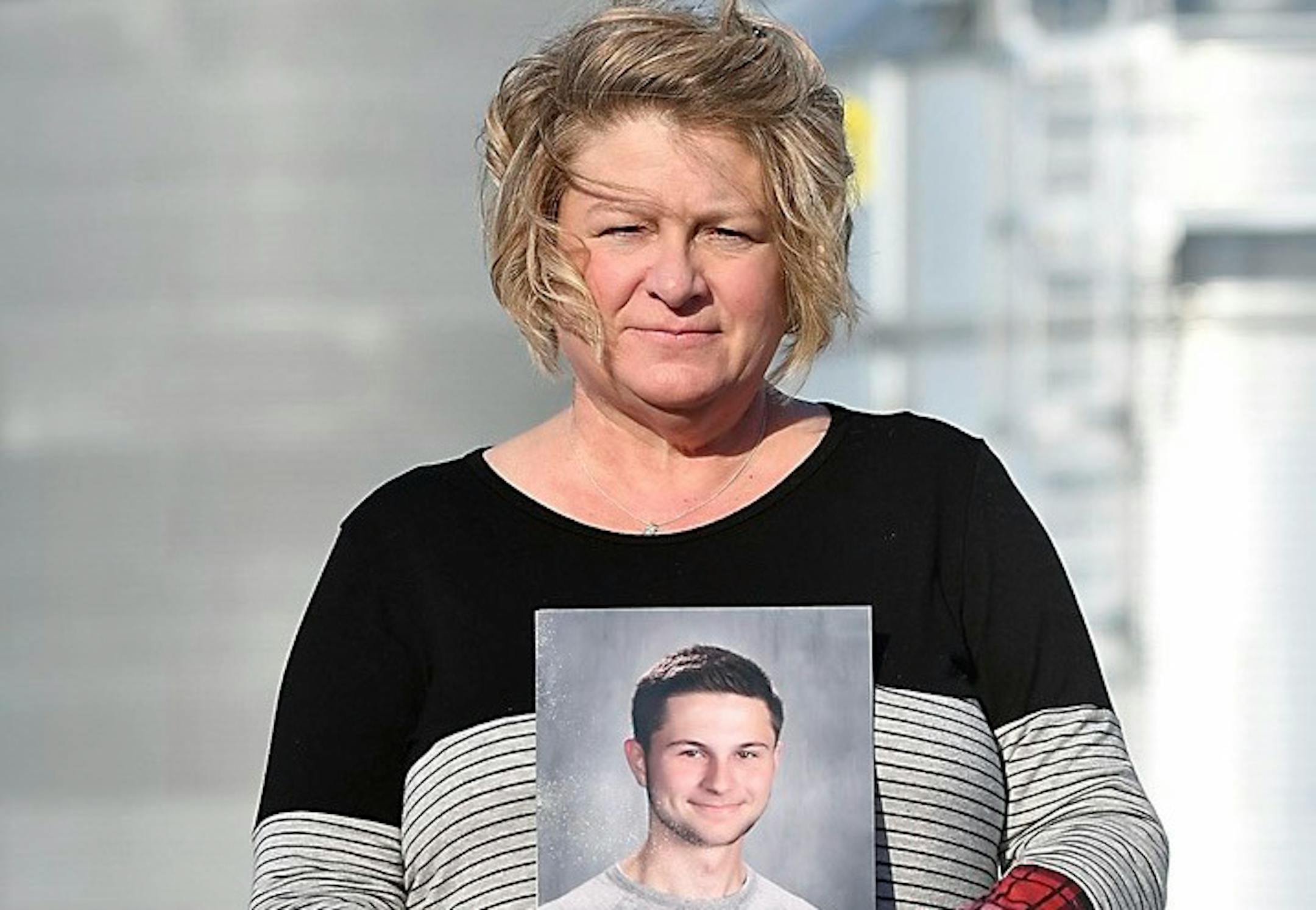 Michele Gran held a photo of her 18-year-old son, Landon, on her family's farm near Norseland, Minn.