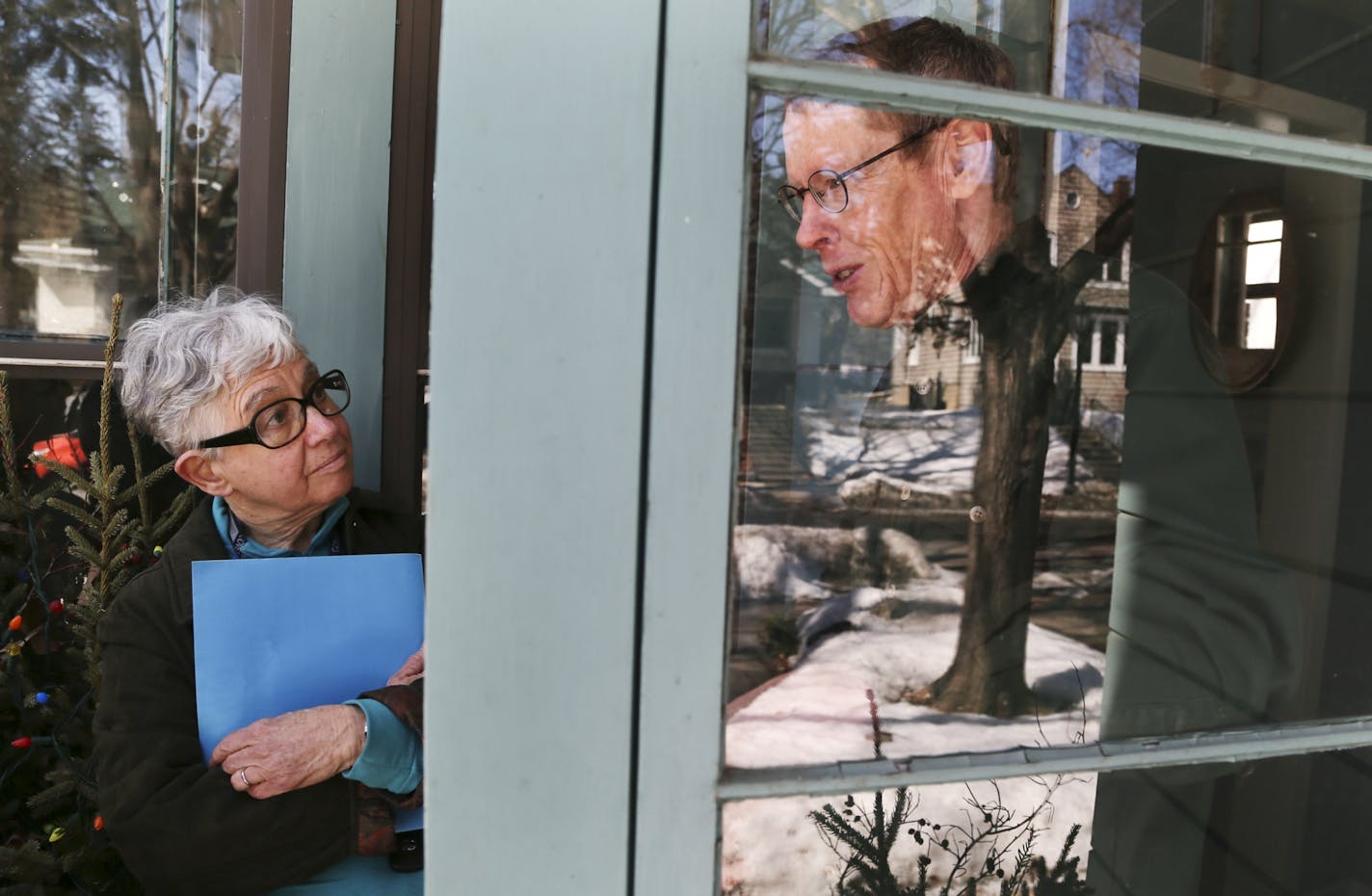 Long-serving State Rep. Phyllis Kahn went on door knocking in the Procpect Park neighborhood to check in on delegates in her district, including Chip Halbach, right, Saturday, March 29, 2014, in Minneapolis, MN.