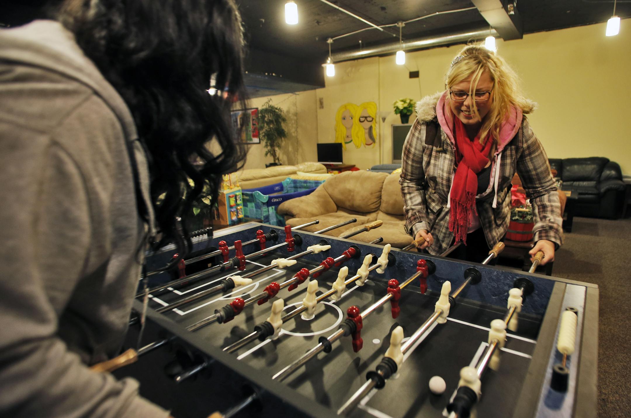 Trinity Fletcher, 20, has experience as a homeless teenager. She now volunteers at the Hope 4 Youth drop-in center in Anoka, below, and is a member of the board.