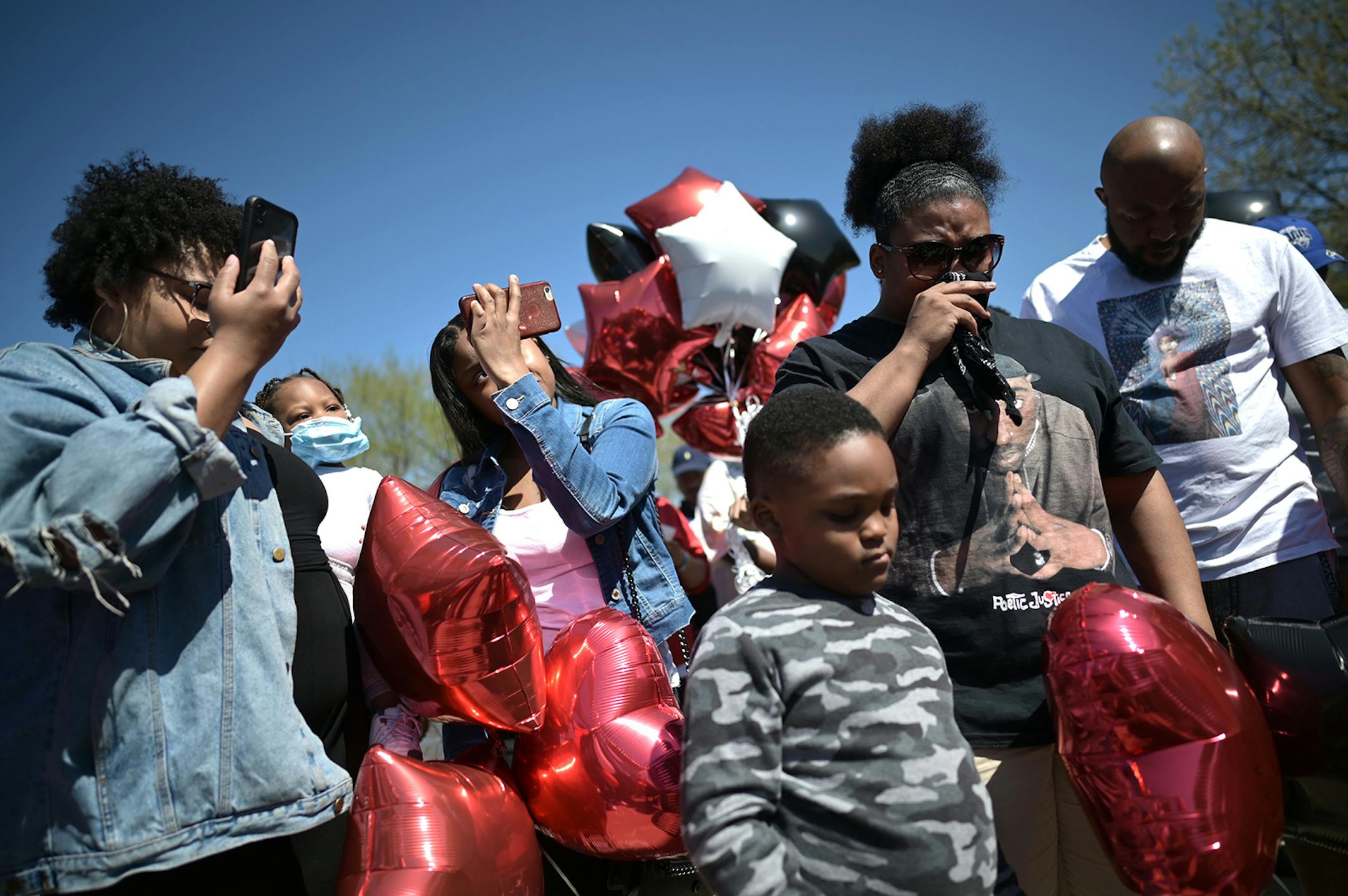 Family and friends mourned the loss of Douglas Lewis during a prayer held Sunday afternoon at his memorial. A memorial was held for Lewis, who was shot and killed Friday night, on Sunday, May 3, 2020 at the Burns Avenue Scenic Overlook in St. Paul, Minn.