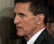 National Security Adviser Michael Flynn arrives in the east Room of the White House in Washington, Monday, Feb. 13, 2017, for a news conference with P