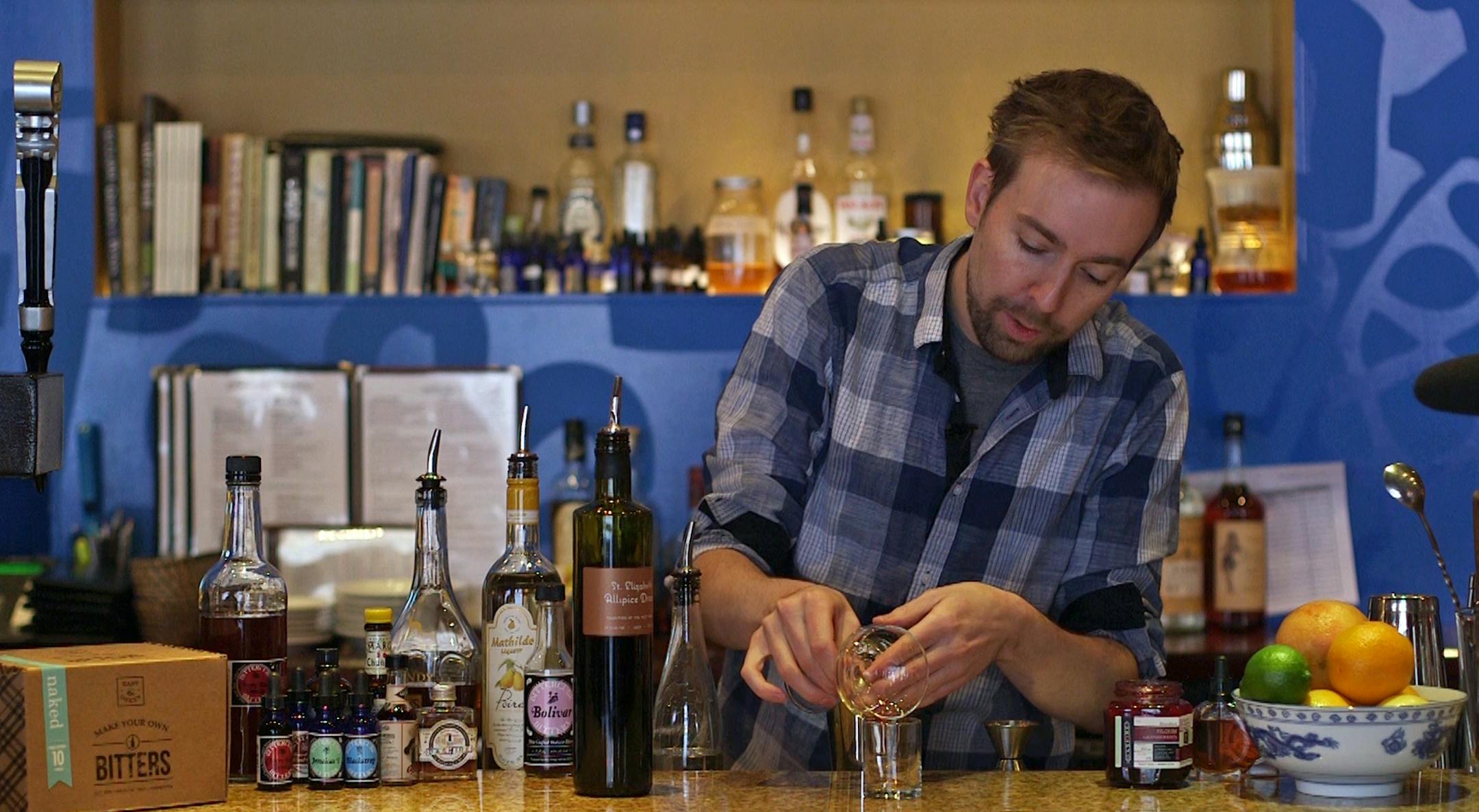 Bartender Robert Jones at Saffron demonstrates drinks made with bitters. ] still frame from video