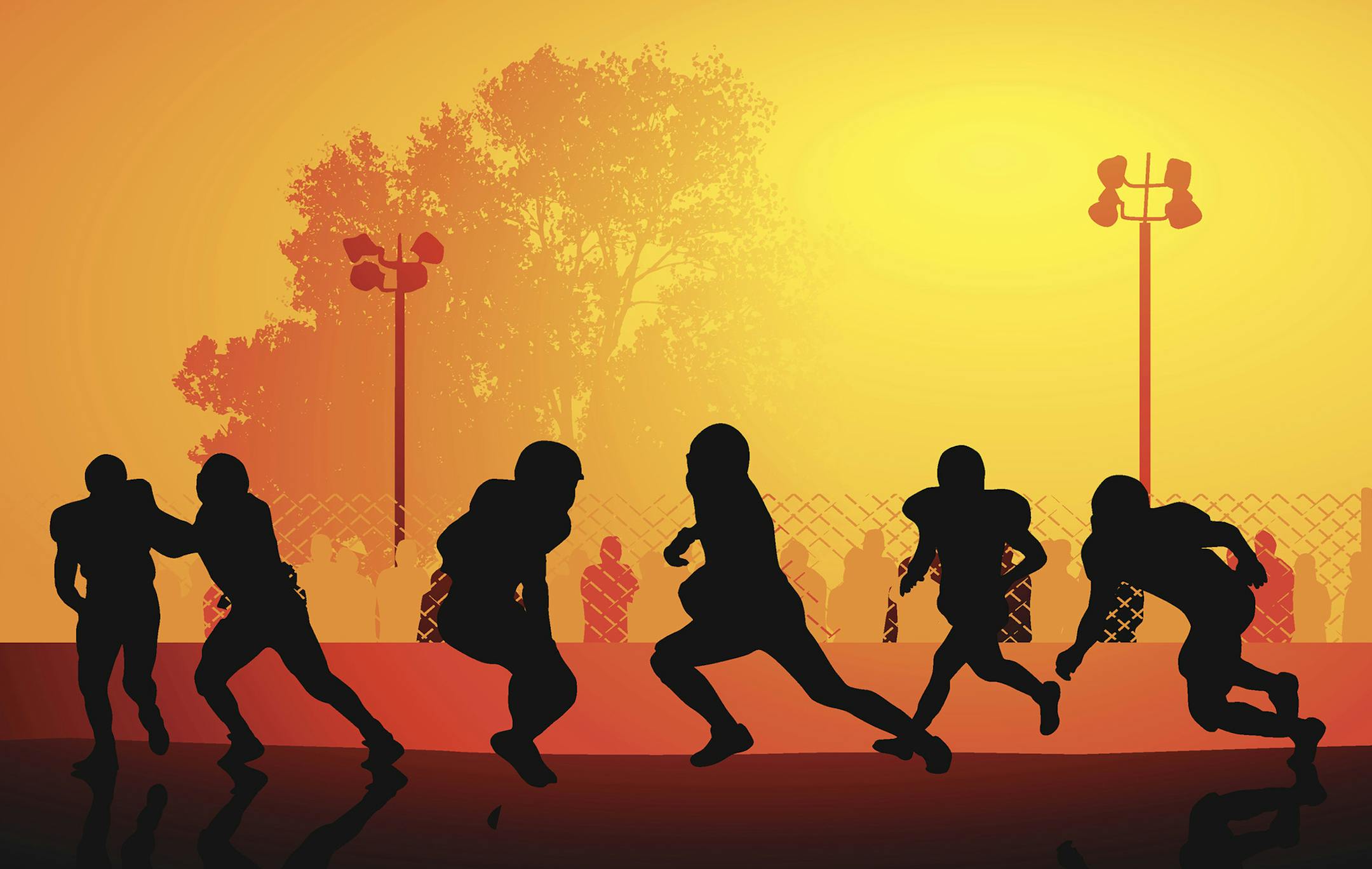 iStockphoto.com
High schoolers playing football, with spectators watching.