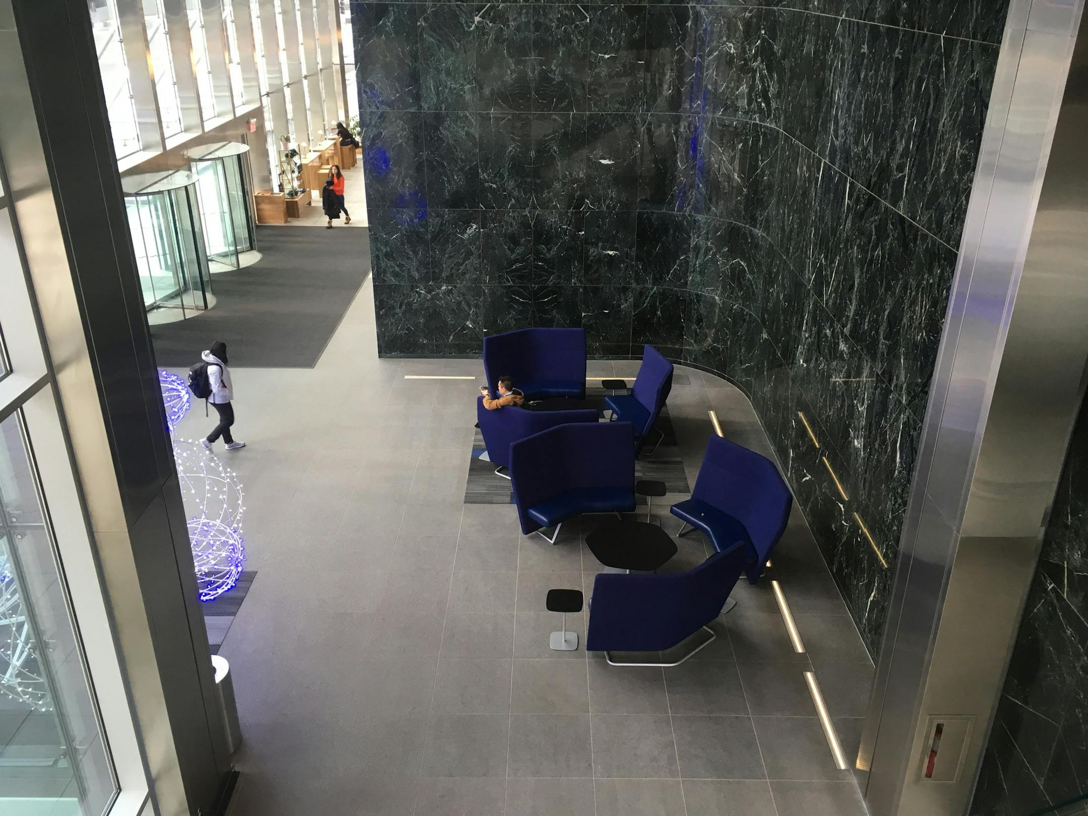 Many building owners have added attractive lobby areas, such as this one outside Penny's coffee shop at 100 Washington Square.
